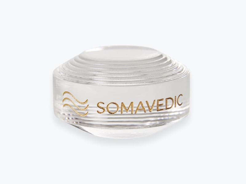 Doplněk Somavedic Button na bílém pozadí.